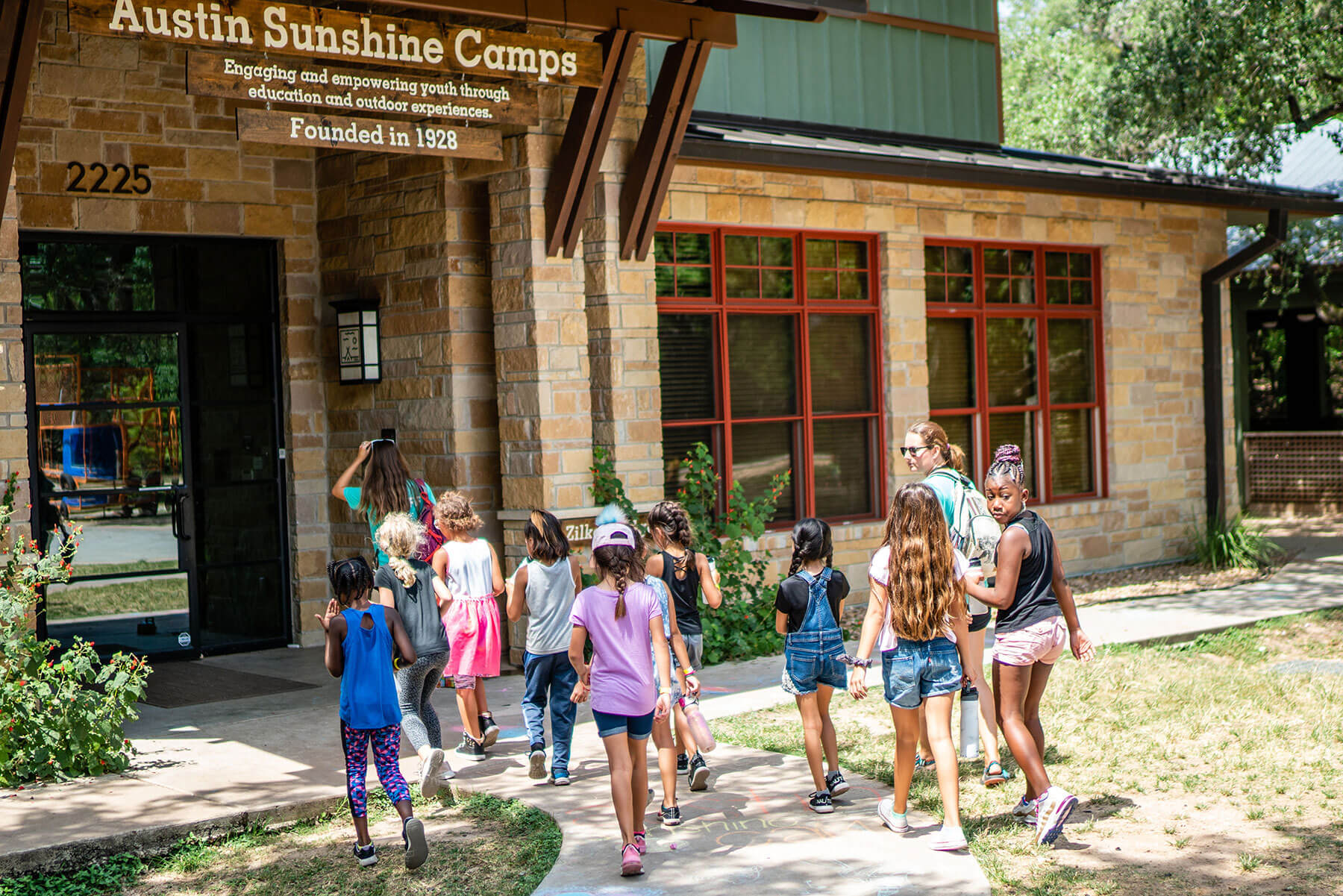 Group of Austin Summer Camp campers entering the Austin Summer Camp facilities