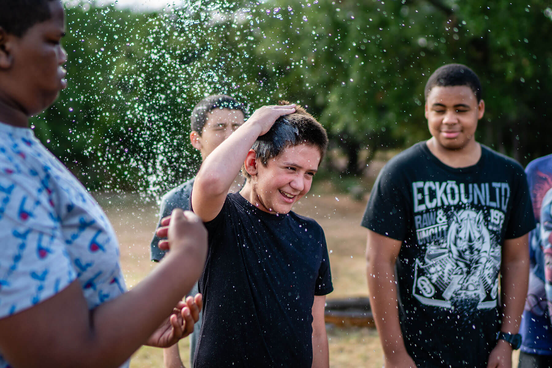 Camper splashed with water at Austin Sunshine Camps